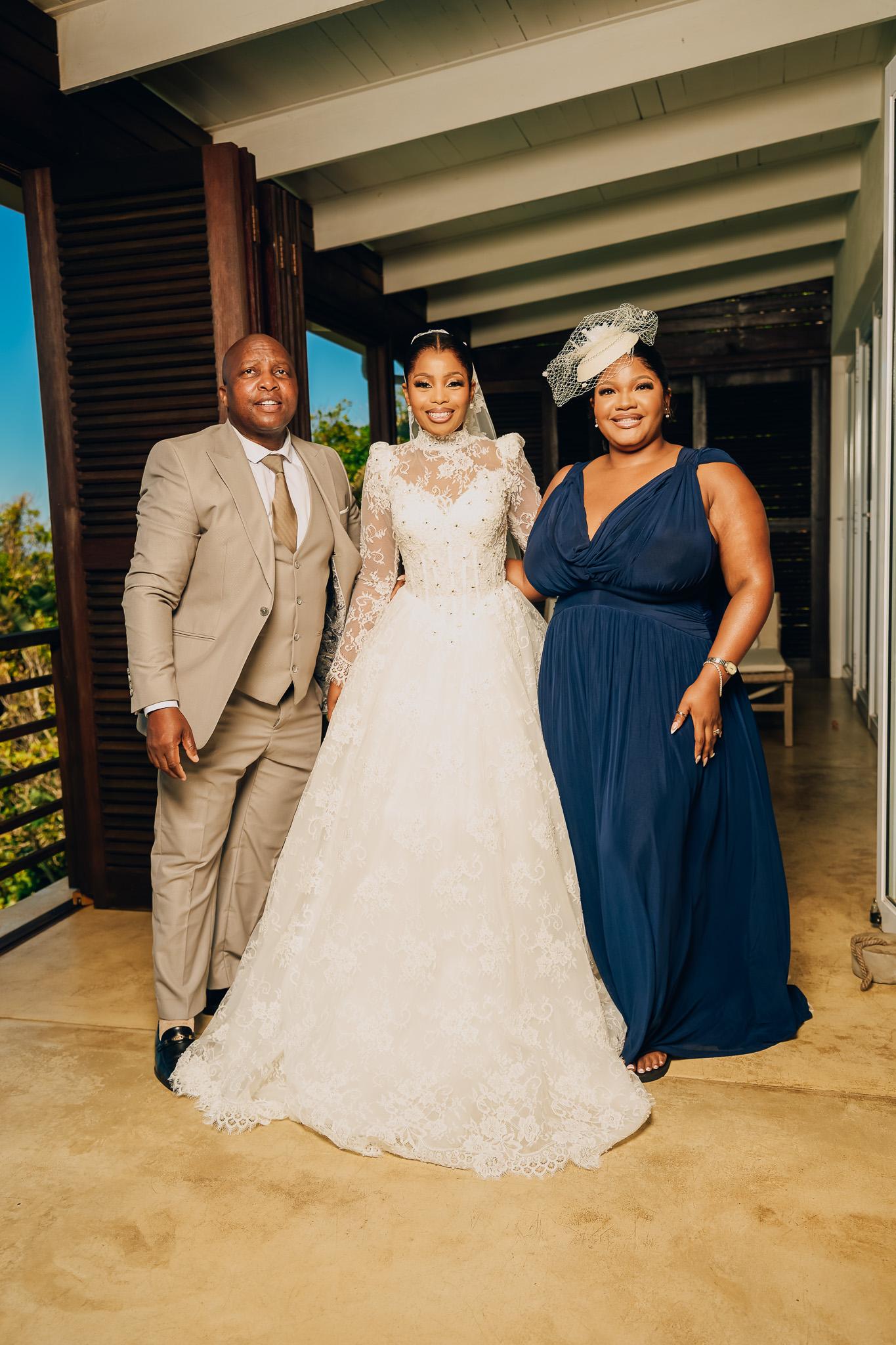 Bride standing between two guests before the wedding ceremony.