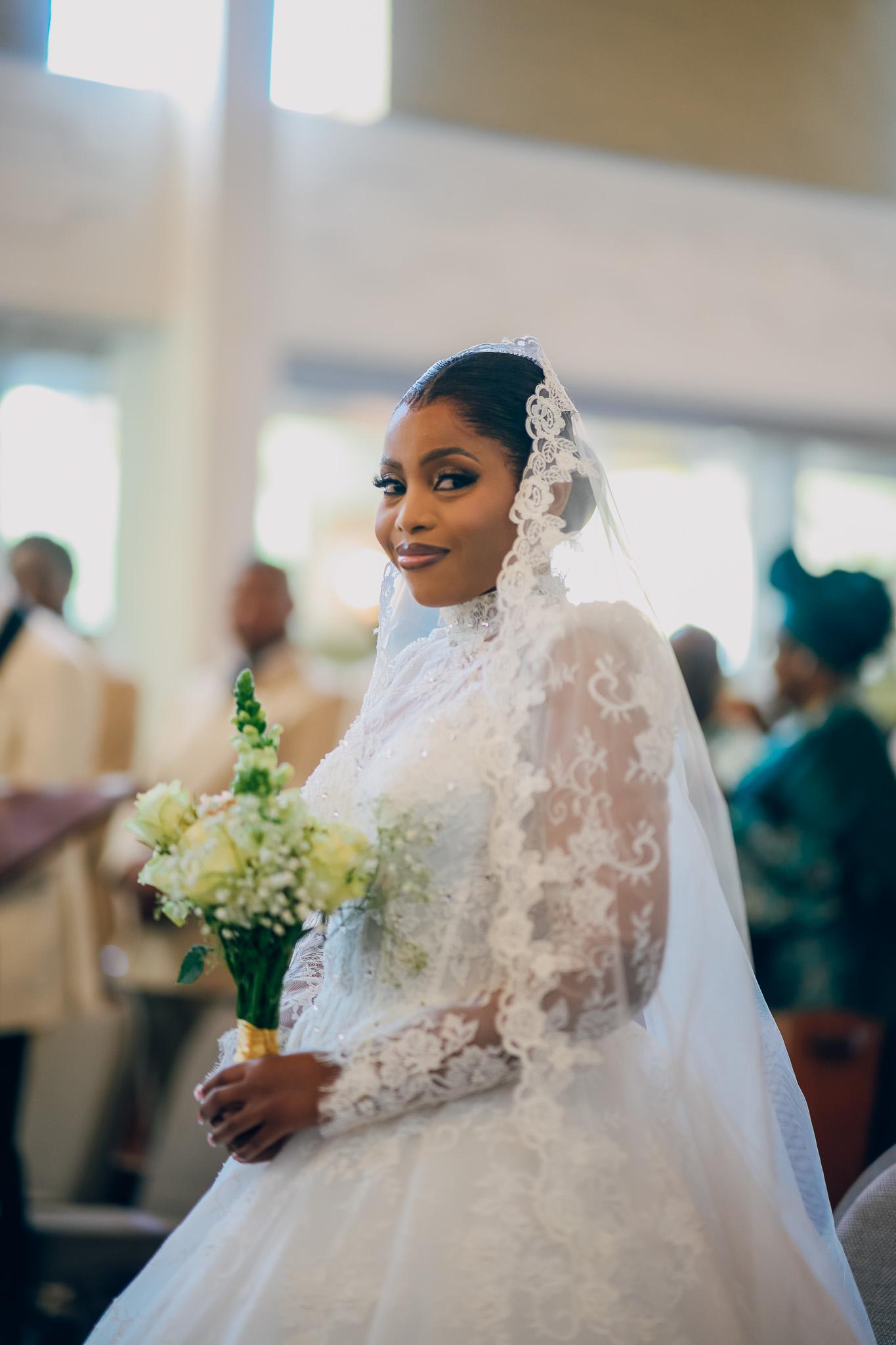 Bride holding her bouquet during the church service.